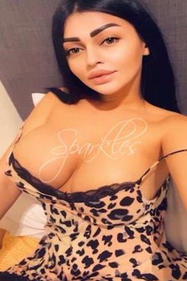 Slim dark haired girl with huge 34E breasts in a leopard pattern nightie